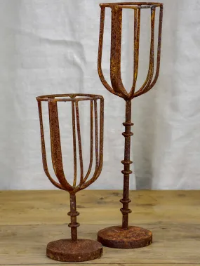 Pair of cup-shaped rustic candlesticks